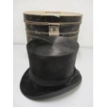 A top hat inscribed A Fryett Clapham to the inside with tin hat box