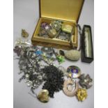 A mixed lot of mainly costume jewellery to include a Continental silver brooch, badges and other