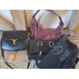 A Radley hobo style handbag in burgundy, a Henry's of London black leather shoulder bag and an