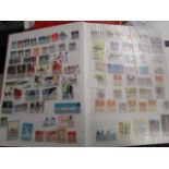 A stamp album containing British and other stamps from around the world