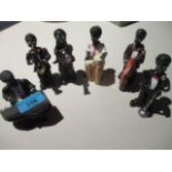 A composition six piece figural group of musicians