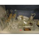 Glassware to include three sets of six pedestal glasses, a claret jug fashioned as a duck, a 19th