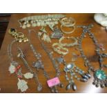 Costume and silver coloured metal jewellery, a Moroccan bracelet, an Iraq necklace, bangle and other