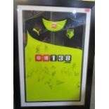 A signed Watford football shirt, framed