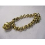 A yellow metal gold coloured bracelet with charm, stamped 750