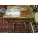 A Victorian walnut veneered fold over and swivel top work/games table with hinged top and inset