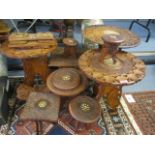 A collection of Indian carved items to include book stands, folding occasional table and other items