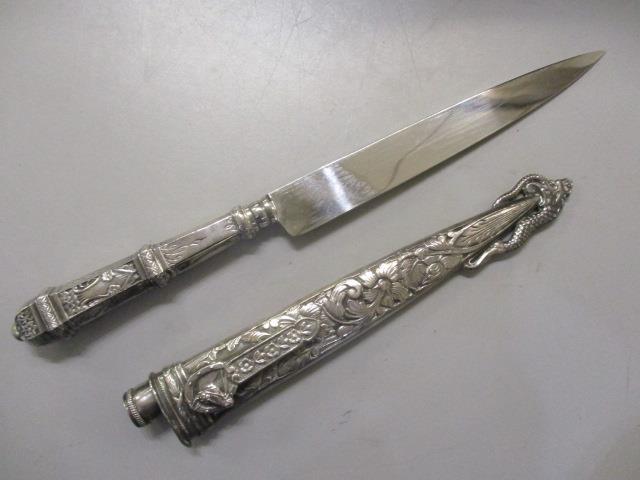 A white metal handled Indian knife and scabbard A/F