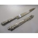 A white metal handled Indian knife and scabbard A/F