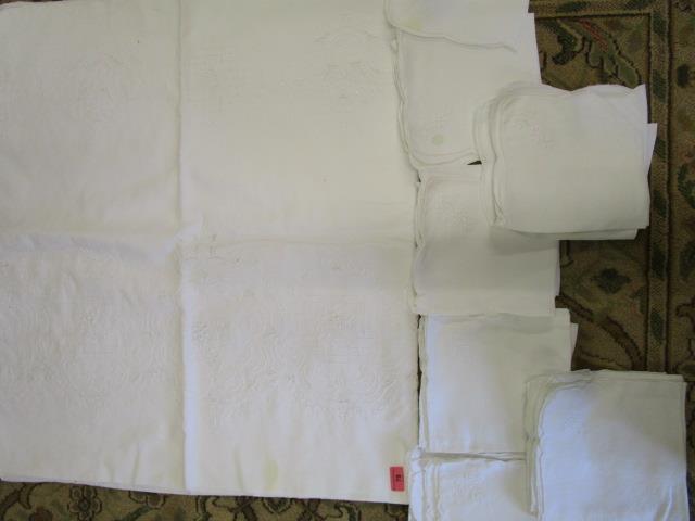 A large embroidered table cloth approx 116" x 67" and twenty three similar designed napkins