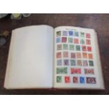 A stamp album containing mixed stamps from around the world