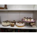 An art glass footed bowl and a quantity of display cakes