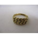 An 18ct gold woven design ring