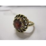 A 9ct gold garnet set ring