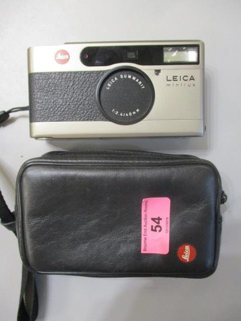 A Leica Minilux camera with case