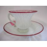 A 20th century Venetian air twist glass cup and saucer