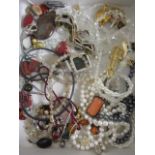 Costume jewellery to include pearl necklaces, crystal necklaces, a scorpion brooch, amber coloured