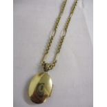 A 9ct gold and gold coloured locket