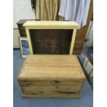 A late Victorian/early 20th century pine chest on a plinth base and twin wrought iron carrying