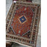 A Persian design rug having geometric designs and multiguard borders, 60" x 46"