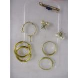 A pair of gold coloured metal earrings stamped 375, an 18ct gold and diamond ring, a yellow metal