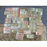 A selection of bank notes from around the world to include Saudi Arabia, Singapore, Australia and