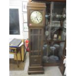 A 1930s oak cased grandmother clock, the silver dial inscribed Germany, no weights, 74 1/2" h