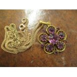 A 9ct gold necklace and a gilt pendant set with purple cabochons