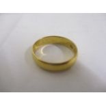 A 22ct gold wedding band, 3g