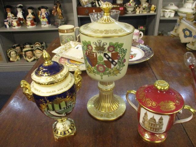 Three commemorative cups and covers, comprising a Coalport St Paul's limited edition 57/250, Spode