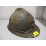 A WWI French helmet, a flaming bomb with RF to the centre