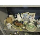 A collection of railway items to include collectors plates, Wade dishes, two albums of cigarette