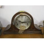 An early 20th century oak mantle clock