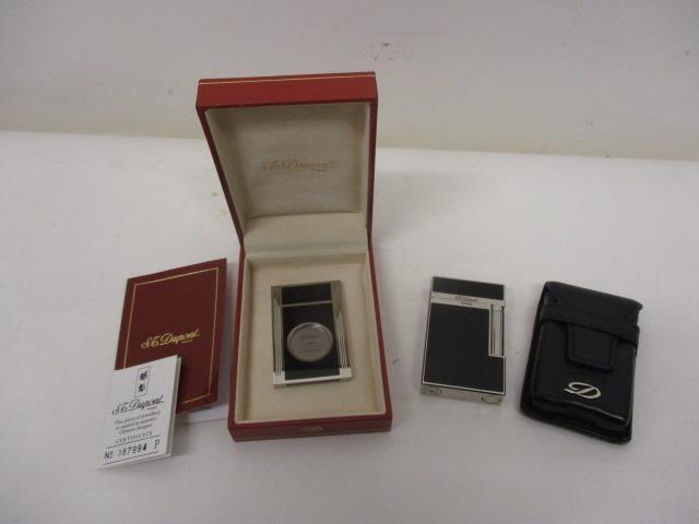 A DuPont white metal and lacquered cigar cutter no 87994 with certificate and booklet in a