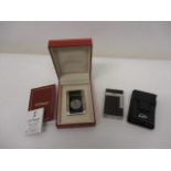 A DuPont white metal and lacquered cigar cutter no 87994 with certificate and booklet in a