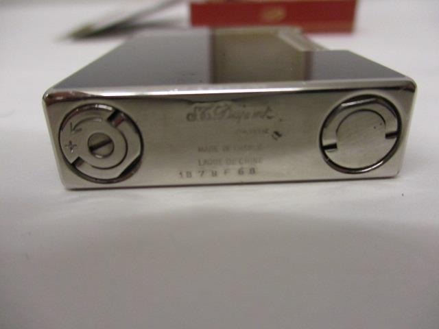 A DuPont white metal and lacquered cigar cutter no 87994 with certificate and booklet in a - Image 6 of 14