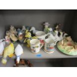 A quantity of duck and geese ornaments, three car tankards and other items