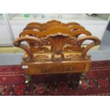 A William IV walnut Canterbury, the sections united by turned spindles, the base with a single