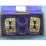 A pair of 19th century white metal framed buckles, each set with paste stones in the form of