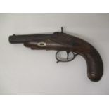 A mid 19th century percussion cap action pistol with a walnut grip, a floral engraved side plate and