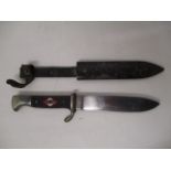 A German Hitler Youth dagger, the textured handle having a red and white enamelled panel with a