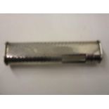 A Dunhill silver plated Butain dress lighter with rounded sides and ribbed body