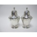 A pair of Victorian Art Nouveau silver Sugar Casters of baluster form with embossed and engraved