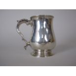 A George III silver baluster Mug with leafage scroll handle, London 1770, maker: John Deacon