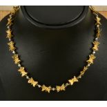 A Charles de Temple 18ct gold and Diamond Necklace consisting of twenty-two butterfly shaped links