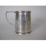 A George V Irish silver Christening Mug with reeded bands, floral and leafage frieze, engraved