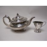 A George IV silver circular Teapot with gadroon rim, London 1827, maker: W.F, A/F and Edward VII