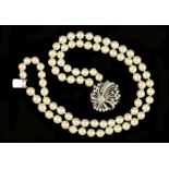 A double row Cultured Pearl Choker with diamond flower head cluster clasp claw and pavé-set baguette