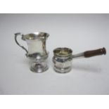 An Edward VII silver Christening Mug, semi-fluted, scroll handle on pedestal base, Chester 1904, and