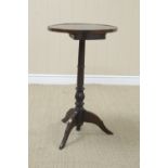 A small 18th Century Pillar Table with bound circular top, fitted small drawer under, on turned